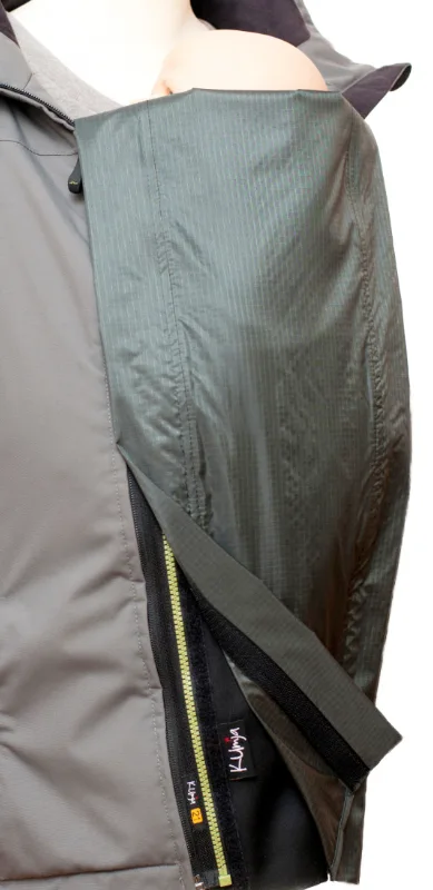 Kumja with the rain cover attached, in a jacket